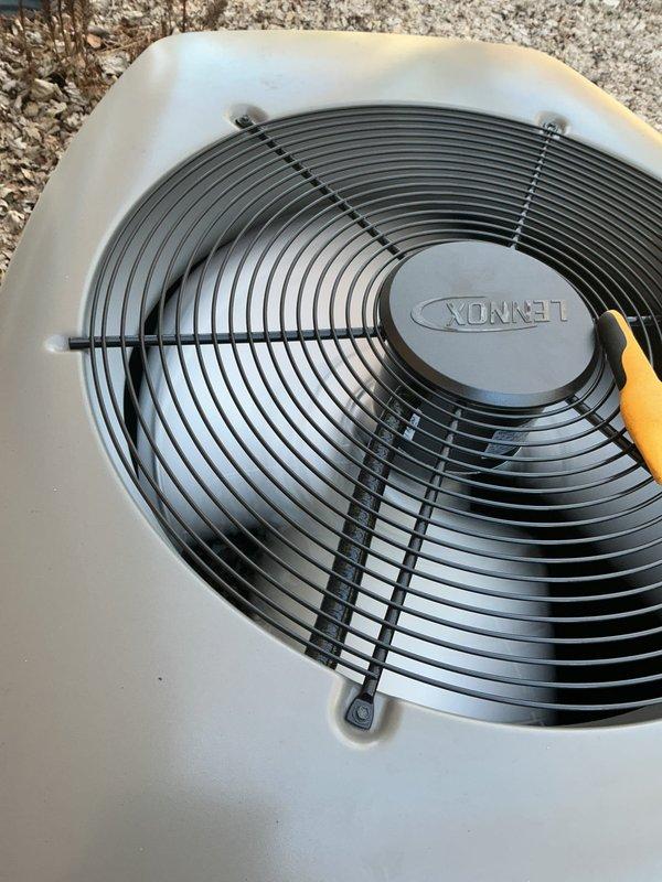 Completed startup of newly installed Lennox air conditioning system. Unit properly positioned on black pad with mulch surrounding the outdoor condenser. Verified proper fan operation and electrical connections, with all components functioning as expected.