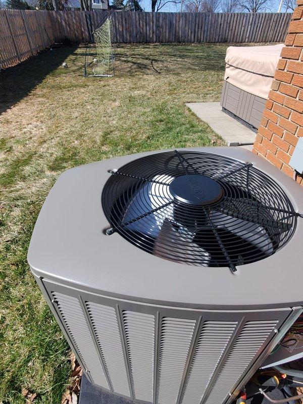 Performed AC system start-up service on residential split-system air conditioner. Verified proper installation of outdoor condensing unit on concrete pad adjacent to brick patio area. Confirmed unit operation with appropriate clearances for proper airflow and ventilation.