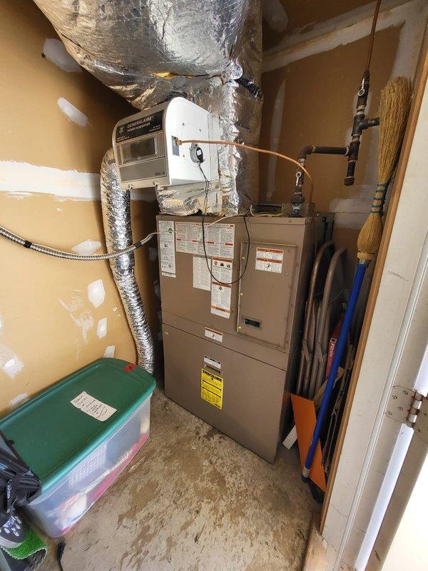 Performed comprehensive evaluation of existing HVAC system in utility closet, including inspection of aging furnace unit with attached ductwork and associated control components. Assessment included examination of installation configuration, available space constraints, and current ventilation setup to provide customer with accurate full system replacement estimate as requested for their second opinion.