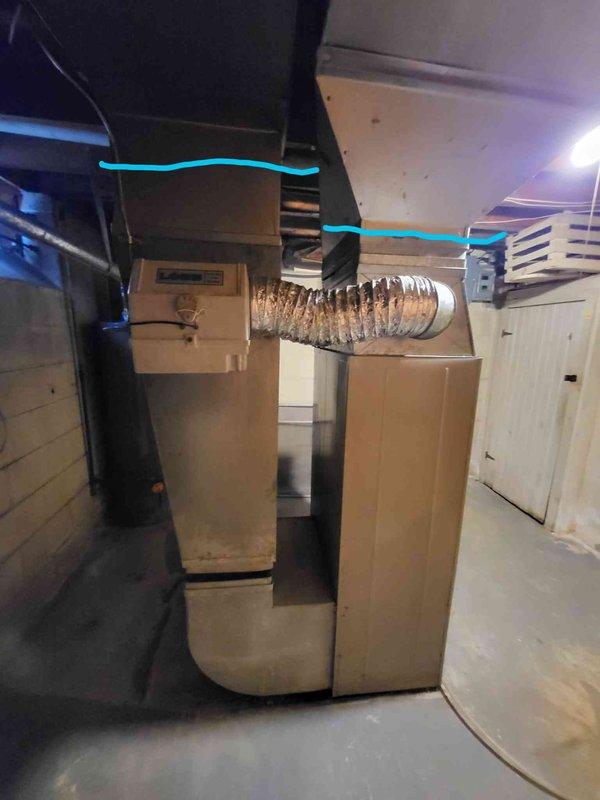 Performed evaluation of aging gas furnace in basement showing significant noise issues during operation. Unit appears functional but at end of service life, with visible wear on ductwork connections and potential efficiency concerns. Replacement quote provided for new high-efficiency system that would address noise concerns and improve overall heating performance while maintaining compatibility with existing ductwork configuration and nearby water heater installation.