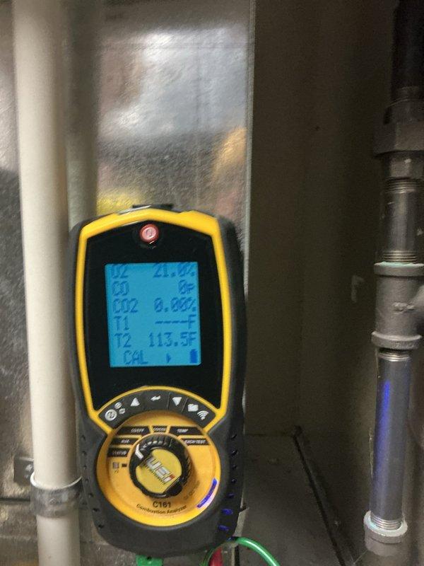 Diagnosed 15-year-old thermostat displaying sensor error code, though system remained operational. Performed diagnostic testing with Fieldpiece C197, recording temperature readings of 89.4°F and 113.5°F at different test points, confirming thermostat failure. Documented condition with photos for warranty processing.