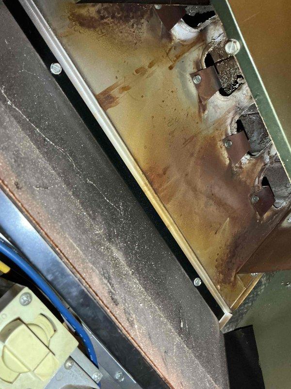 Performed tune-up service on aging furnace (10+ years old) with significant rust and corrosion observed on heat exchanger components. Inspected and cleaned interior mechanical elements, including control boxes and valve actuators that showed dust accumulation and wear. Completed comprehensive system evaluation including thermostat, humidifier, and relatively new hot water tank (<1 year old) as part of preparation for home daycare operation.