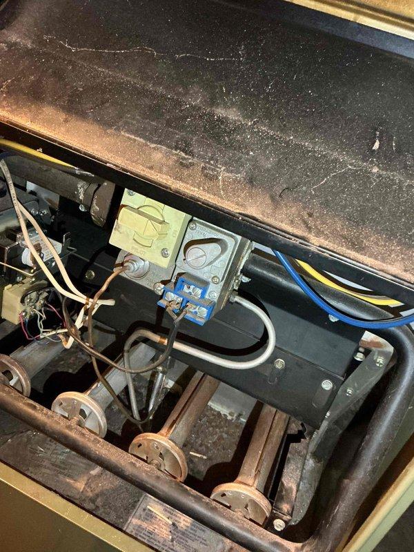 Performed tune-up service on aging furnace (10+ years old) with significant rust and corrosion observed on heat exchanger components. Inspected and cleaned interior mechanical elements, including control boxes and valve actuators that showed dust accumulation and wear. Completed comprehensive system evaluation including thermostat, humidifier, and relatively new hot water tank (<1 year old) as part of preparation for home daycare operation.