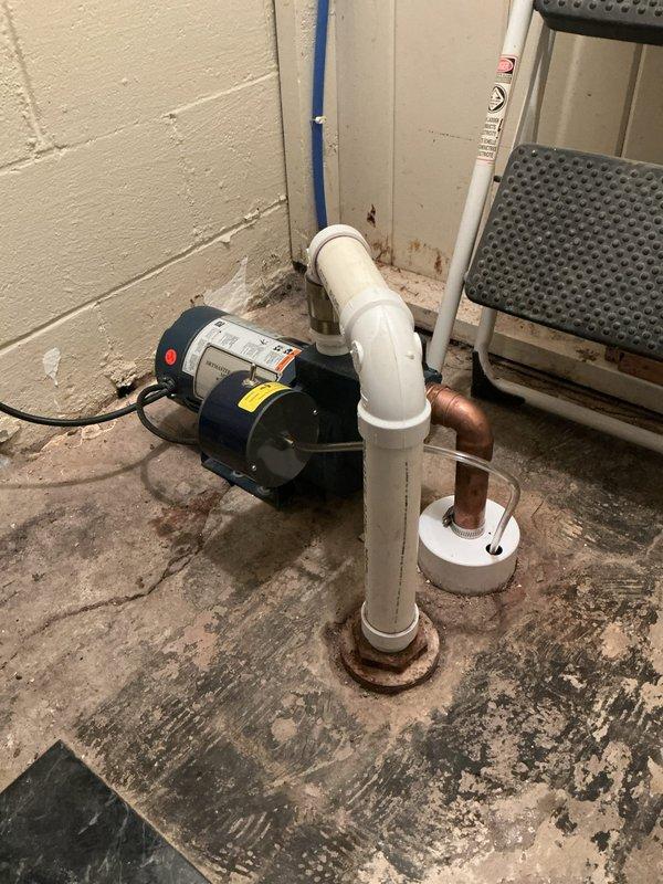 Cleaned and inspected customer's sump pump system which showed signs of extended moisture exposure with visible rust at floor mounting points. Removed drainage pipe which had multiple perforations and replaced the affected components to ensure proper functionality. System is now operating correctly with improved drainage capabilities.