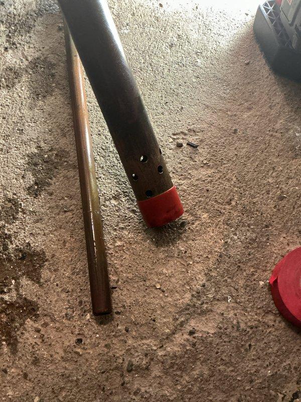 Cleaned and inspected customer's sump pump system which showed signs of extended moisture exposure with visible rust at floor mounting points. Removed drainage pipe which had multiple perforations and replaced the affected components to ensure proper functionality. System is now operating correctly with improved drainage capabilities.