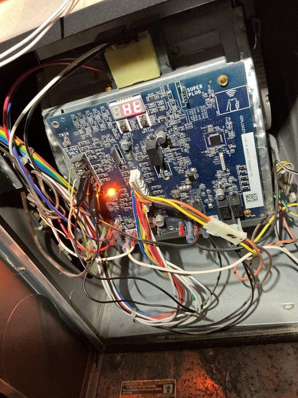 Performed comprehensive tune-up on 15-year-old furnace located in basement. Inspected control board functionality (verified normal operation with illuminated status LED and digital display), and examined gas valve assembly with particular attention to connections and seals. Completed standard maintenance checks on associated components including humidifier, thermostat, and hot water tank as requested.