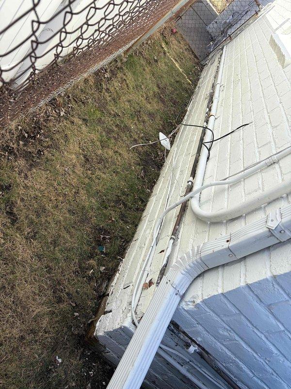 Completed insulation of outdoor line set per warranty requirements. Addressed corrosion issues on exterior piping and ensured proper sealing against the building's exterior wall. Photographic documentation taken of completed work showing the properly insulated line set installation.