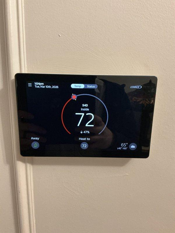 Responded to service call for newly installed furnace displaying "urgent service needed" notification on Lennox thermostat. Inspected electrical panel and verified proper circuit breaker installation and labeling for HVAC system. Confirmed thermostat was functioning correctly with proper temperature display and settings. No issues found with system operation; reset service notification and verified normal operation.