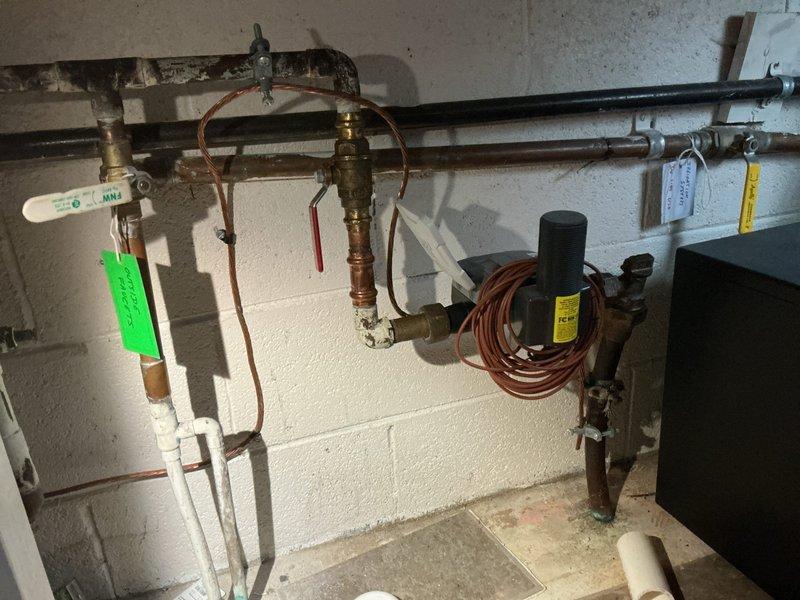 Responded to service call for kitchen faucet making loud noise when turned off and water appearing to run underneath when faucet is off. Diagnosed excessive water pressure as the cause of the hammering noise and leaking issue. Installed pressure regulator valve to normalize system pressure and replaced worn faucet cartridge to resolve the continuous water flow problem.