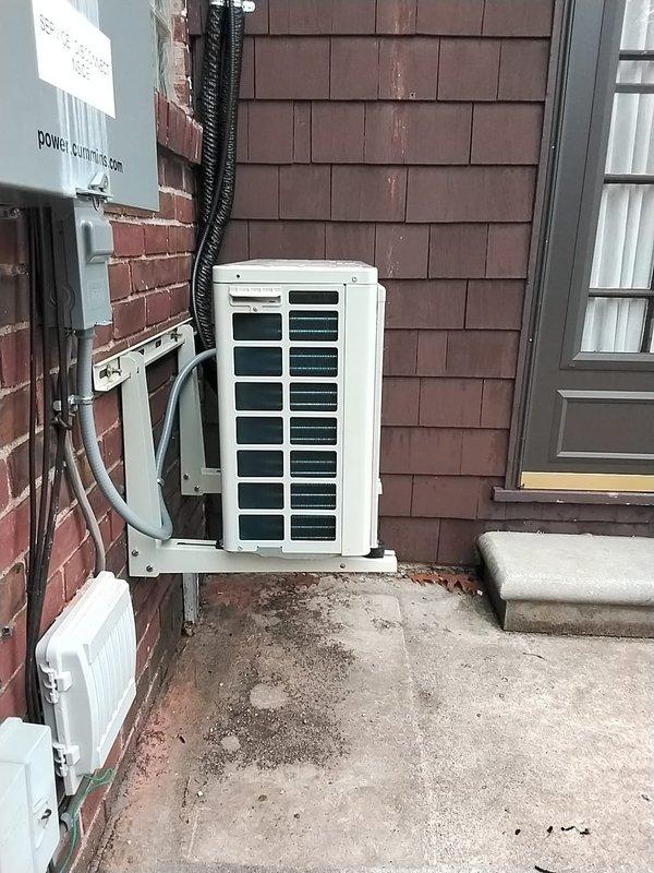 Inspected mini-split installation that was previously reported as having a crooked outdoor condenser unit. Verified proper mounting of indoor head unit on brick wall with secure bracket installation and appropriate line set routing. Corrected outdoor condenser unit positioning and secured it properly to ensure level installation and optimal operation.