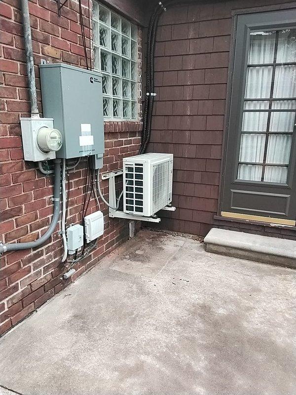 Inspected mini-split installation that was previously reported as having a crooked outdoor condenser unit. Verified proper mounting of indoor head unit on brick wall with secure bracket installation and appropriate line set routing. Corrected outdoor condenser unit positioning and secured it properly to ensure level installation and optimal operation.