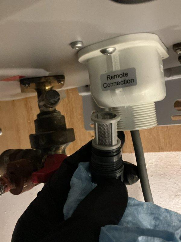 Responded to service call for Rheem tankless water heater displaying error code 88 with no hot water output. Inspected remote connection assembly and removed filter screen for cleaning. Performed descaling procedure on heat exchanger and verified proper operation of hot/cold water lines and gas connection. System functioning normally after service with no error codes present.