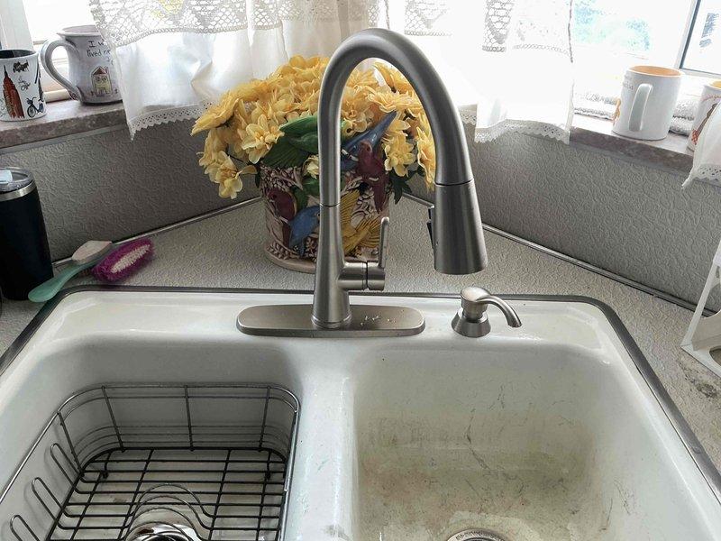 Successfully installed a new stainless steel pull-down kitchen faucet in a 20-year-old home. Replaced the existing fixture with a modern unit featuring integrated sprayer functionality. Verified proper water flow and confirmed no leaks upon completion of installation.
