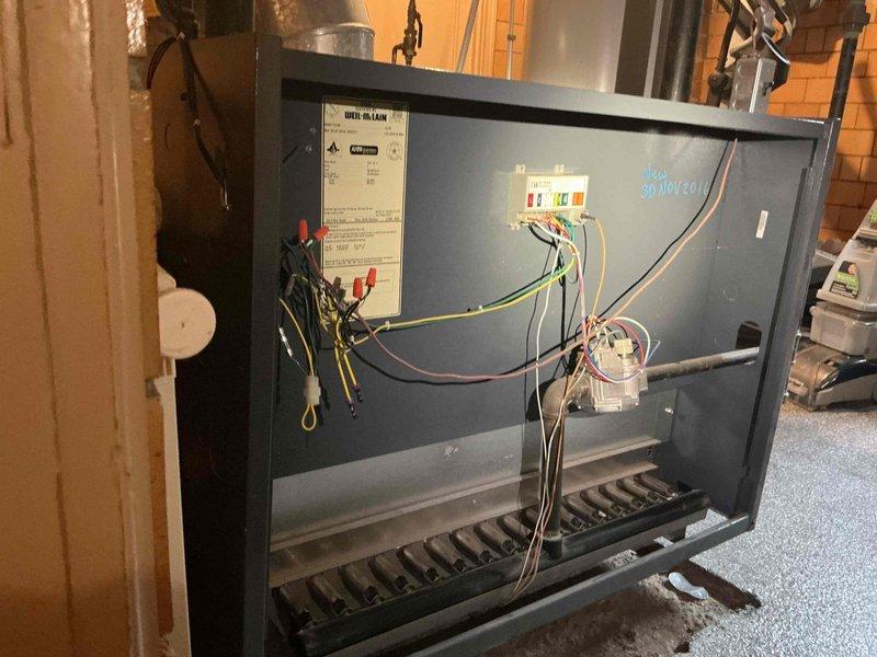 Responded to no-heat call for 5-year-old boiler that was completely non-operational. Inspection revealed loose electrical connector at the control board terminal which had become disconnected. Reconnected terminal properly, tested system operation, and confirmed boiler now functioning correctly.