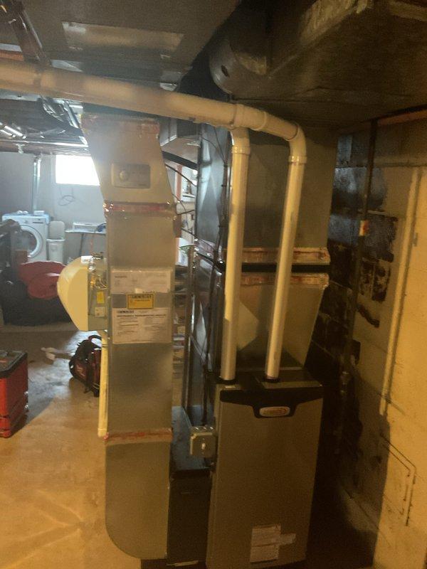 Successfully installed new furnace system with proper PVC venting. Unit was confirmed operational with flame visible through inspection port. Installation included all necessary connections and a permit was obtained as required. Customer is eligible for utility rebate program.