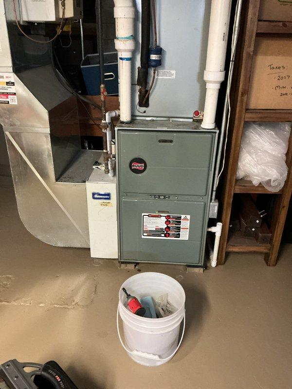 Diagnosed 10+ year old Ruud furnace that failed to produce heat after being inactive for 2 weeks. Identified faulty high limit switch and clogged condensate trap, which were replaced to restore proper system operation. Verified proper heating function before completing service.