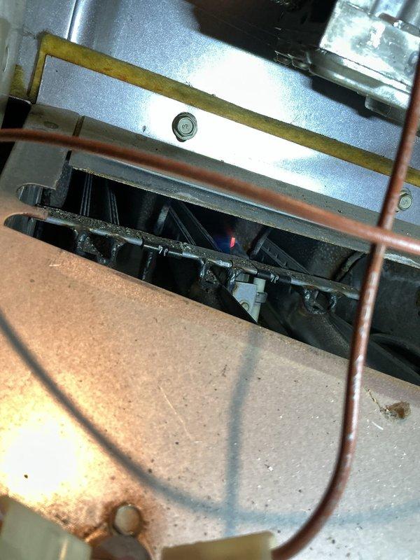 Diagnosed 20+ year old furnace with intermittent operation issues in basement location. Inspection revealed faulty flame sensor and control board requiring maintenance; cleaned sensor and restored electrical connections to restore proper ignition sequence and consistent heating operation.