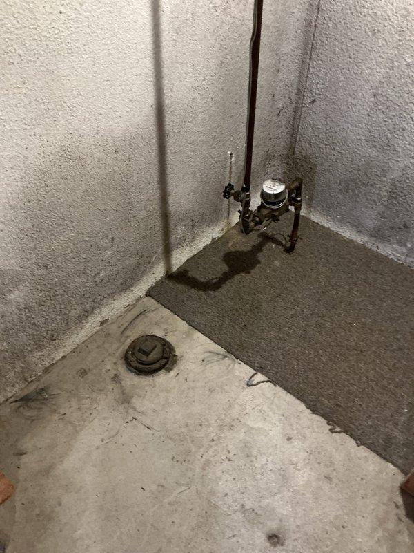 Successfully reconnected tanked water heater in utility room with proper copper and PVC piping connections. Installed necessary valves and pressure gauge at corner junction, ensuring proper function of the system alongside existing HVAC equipment.