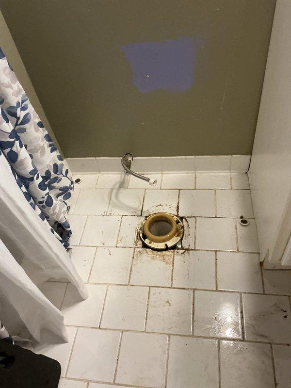 Responded to emergency call for overflowing toilet and tub in main floor bathroom. Diagnosed main drain line blockage causing backflow into fixtures. Removed toilet to access drain system, cleared obstruction using professional-grade auger, and restored proper drainage function. Reinstalled toilet with new wax ring to prevent future leaks.