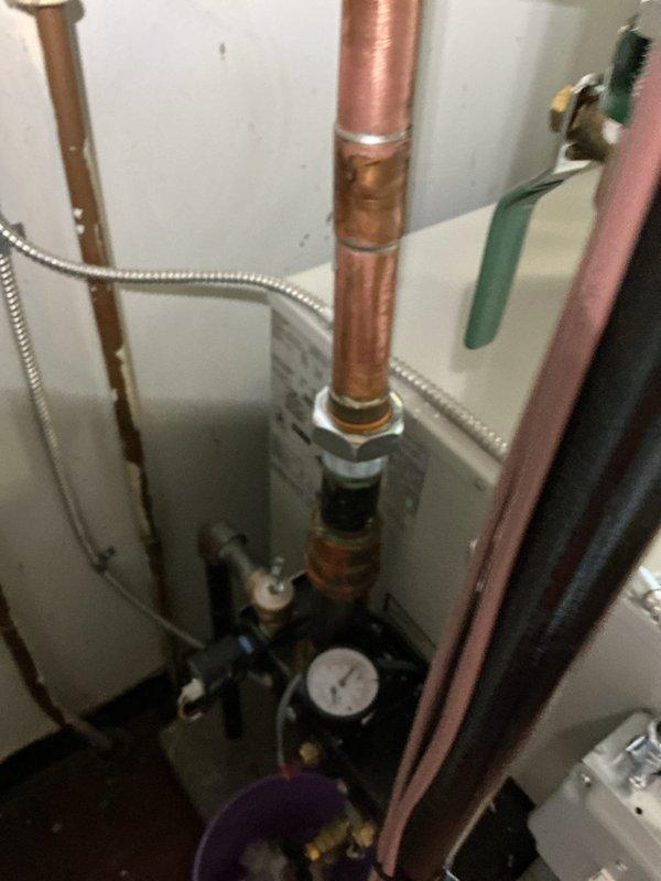 Responded to service call for a slow water leak in a boiler system under warranty. Upon inspection of the copper pipe connections in the basement, identified improper sealing at joint fittings. Repaired the faulty connection to eliminate the leak and verified proper system pressure and operation before completing service.
