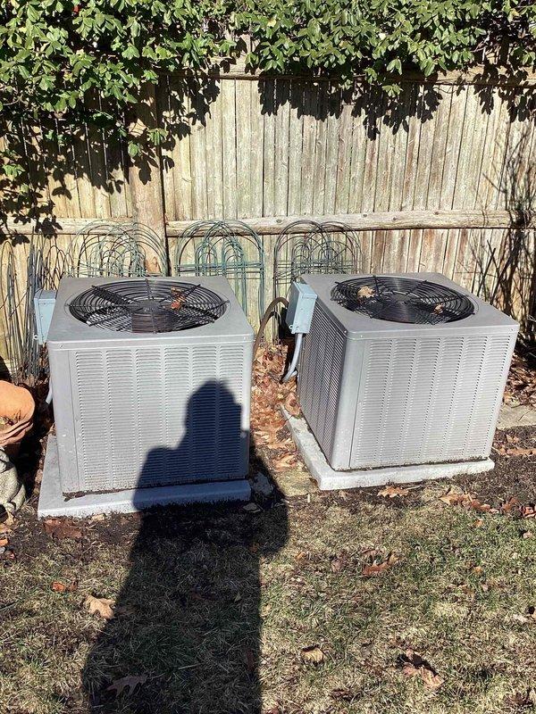 Performed comprehensive assessment of aging HVAC system (20+ years old) including two outdoor AC condenser units and furnace with natural gas fuel source. Evaluation included electrical panel inspection to determine compatibility with potential replacement units. System is currently operational but nearing end of useful service life; customer seeking replacement options for furnace, AC, and generator installation in basement location.