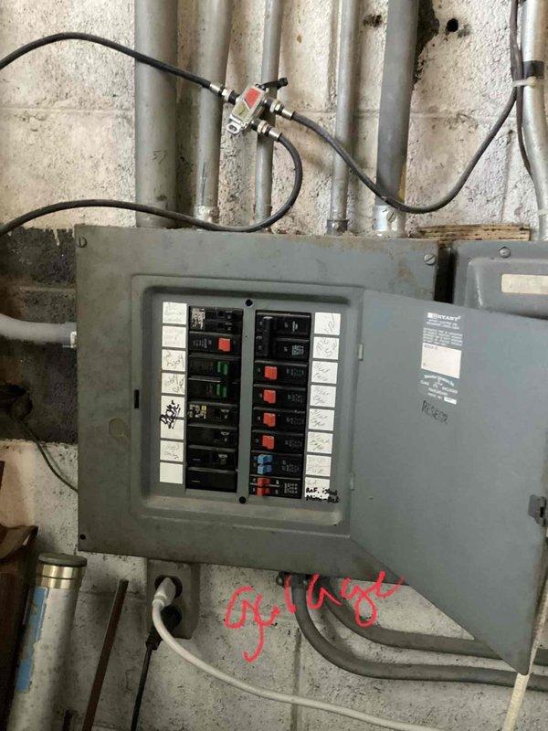 Performed comprehensive assessment of aging HVAC system (20+ years old) including two outdoor AC condenser units and furnace with natural gas fuel source. Evaluation included electrical panel inspection to determine compatibility with potential replacement units. System is currently operational but nearing end of useful service life; customer seeking replacement options for furnace, AC, and generator installation in basement location.