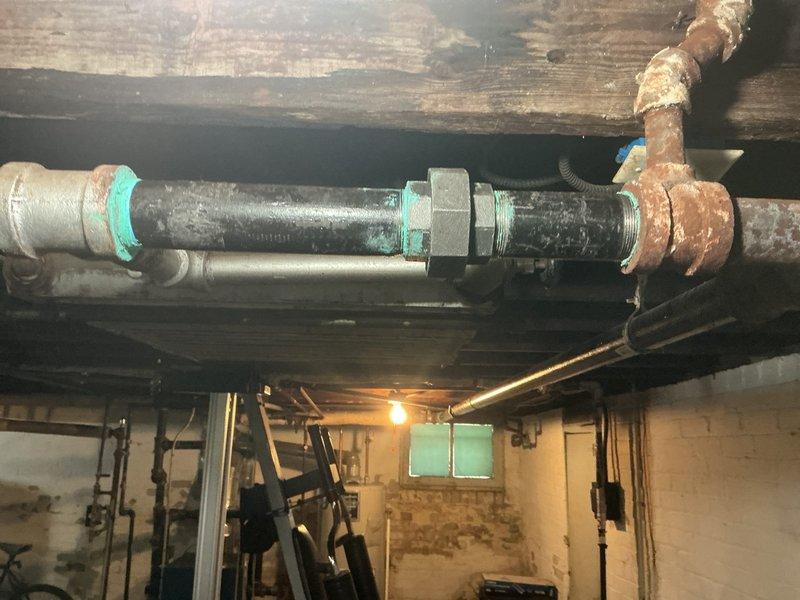Replaced severely corroded steam line segments in basement utility area, focusing on sections with extensive rust damage and failing joints. Installed new pipe fittings with proper thread sealant at connection points and tested system to ensure proper steam distribution without leakage.