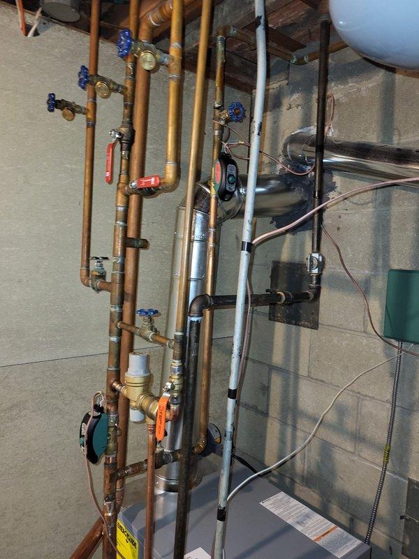 Conducted assessment of oversized boiler system installed by previous contractor. Evaluated hot water heating infrastructure including copper distribution piping, multiple shut-off valves, and existing mechanical components. Prepared estimate for properly sized replacement boiler to address reported performance issues with current unit.