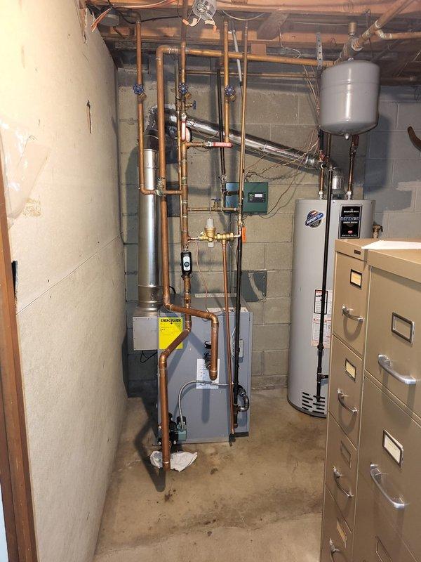 Conducted assessment of oversized boiler system installed by previous contractor. Evaluated hot water heating infrastructure including copper distribution piping, multiple shut-off valves, and existing mechanical components. Prepared estimate for properly sized replacement boiler to address reported performance issues with current unit.