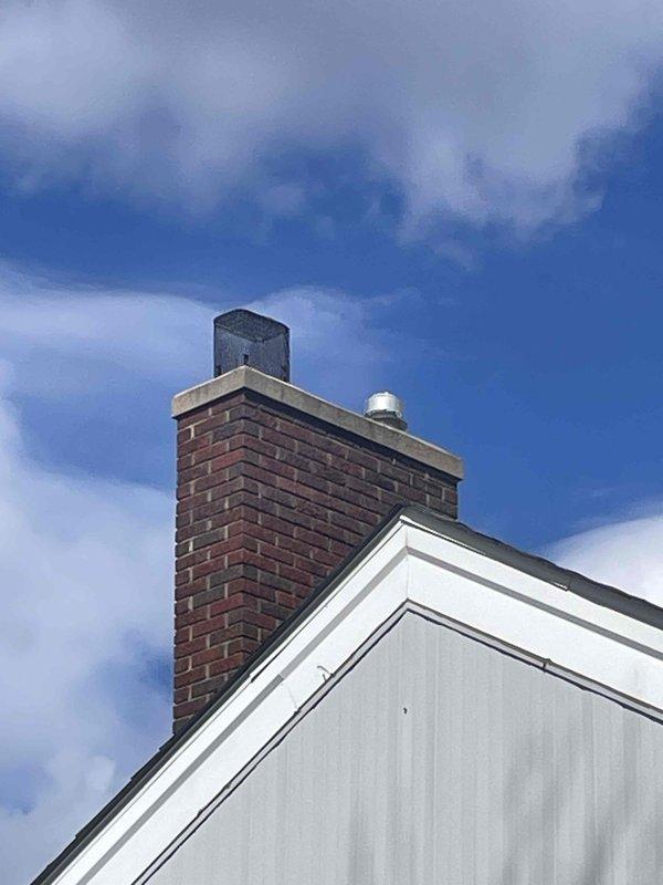 Performed evaluation of 15-year-old residential AC system. Current unit is operational but approaching end of service life. Inspection revealed EnergyAir furnace system with connected AprilAire humidifier and A.O. Smith water heater in basement location, with coil placement also in basement. Roof inspection showed well-maintained chimney venting system. Provided replacement options for aging AC system with natural gas heating configuration.