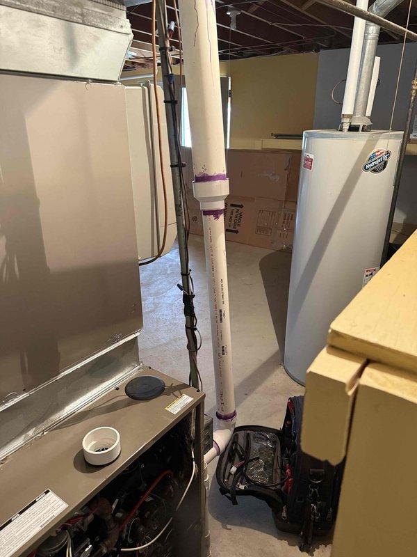 Responded to service call for furnace that shuts off during nighttime operation. Performed diagnostic assessment on furnace unit located in basement, which is under 10 years old. Inspected PVC exhaust venting system and evaluated overall furnace operation to identify cause of intermittent shutdown issue.