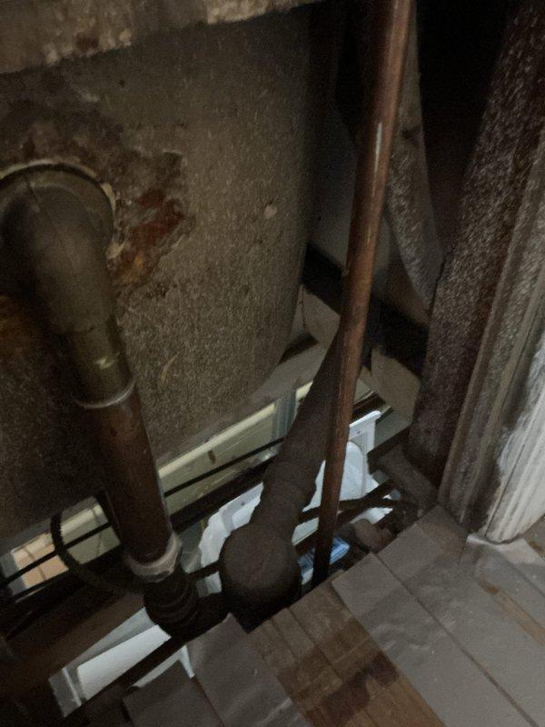 Responded to service call for slow-draining bathtub and laundry drains in century home. Performed thorough inspection of drainage system, including examination of copper plumbing infrastructure showing age-related wear. Successfully cleared blockages in both drain lines using professional-grade equipment, restoring proper drainage functionality to both fixtures.