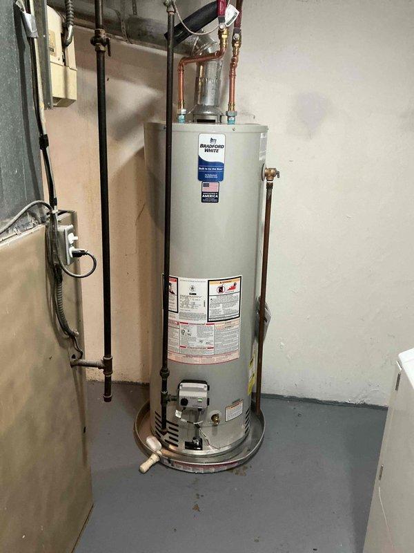 Successfully installed a 40-gallon standard hot water heater with a drip pan and alarm system. Completed all necessary plumbing connections including copper inlet/outlet piping and performed mechanical reconnection to ensure proper functionality.