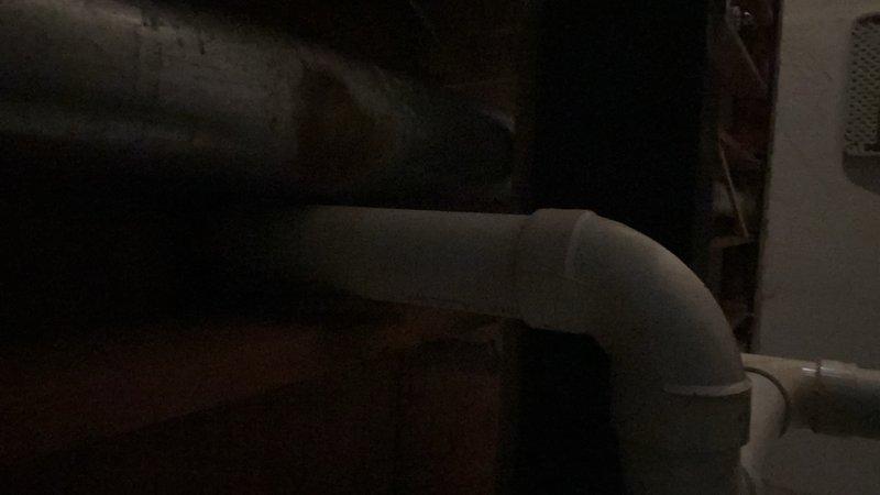 Diagnosed and serviced sump pump system in basement of 40-year-old home. Inspected PVC discharge pipe configuration and surrounding wall structure for moisture damage. Completed maintenance service to restore proper sump pump operation.