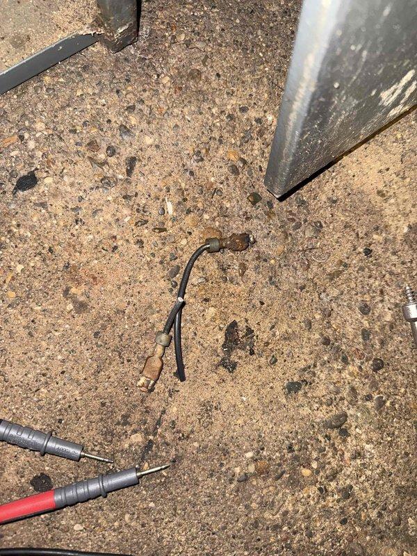 Responded to service call for a non-operational furnace with reported water damage. Upon inspection, found evidence of water infiltration affecting electrical components, with multimeter testing confirming damage to wiring connections. Observed significant corrosion on furnace connections and nearby water heater plumbing, with aging components showing considerable wear on the 15+ year old system.