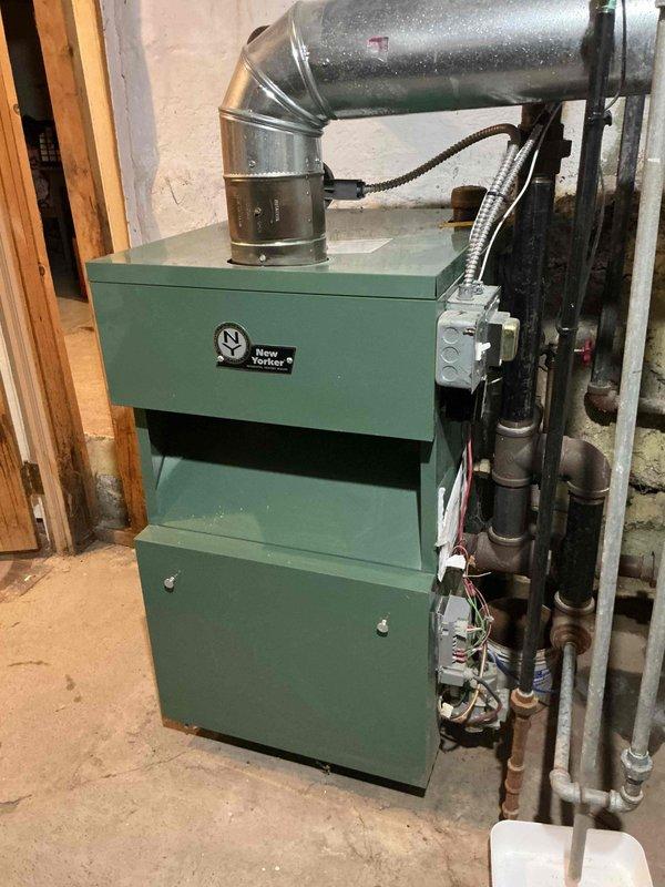 Responded to service call for a 10-year-old New Yorker steam boiler that failed to ignite despite audible clicking. Diagnostic testing with combustion analyzer confirmed proper oxygen levels (20.9%) and zero carbon monoxide emissions, with normal flue temperature readings. Determined issue was related to ignition sequence failure and performed necessary repairs to restore proper operation.
