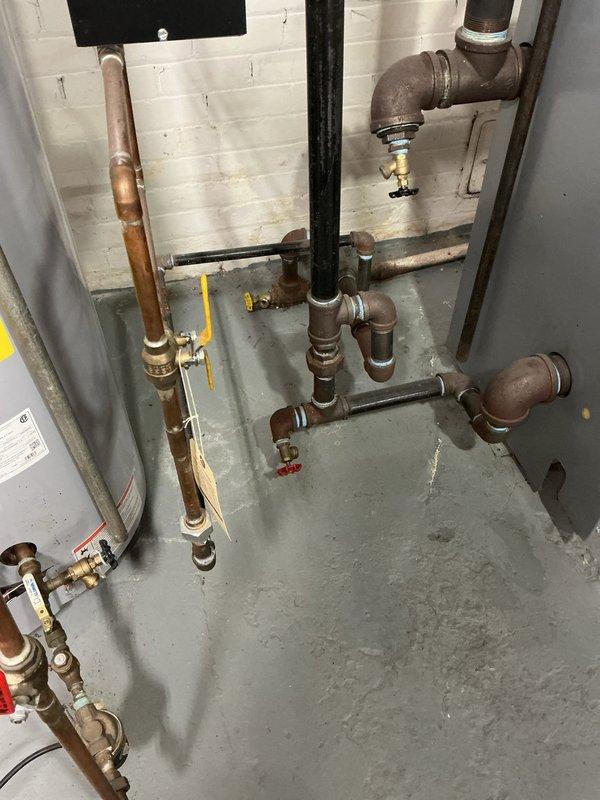 Diagnosed intermittent boiler shutdown issue by inspecting VAT Programmable Water Feeder (model VXT-24) and associated plumbing components. System was functioning at time of service with customer reporting ability to restart without difficulty after shutdowns. Verified proper operation of water level control system and checked all valves, connections, and piping for integrity with no visible leaks or damage observed.