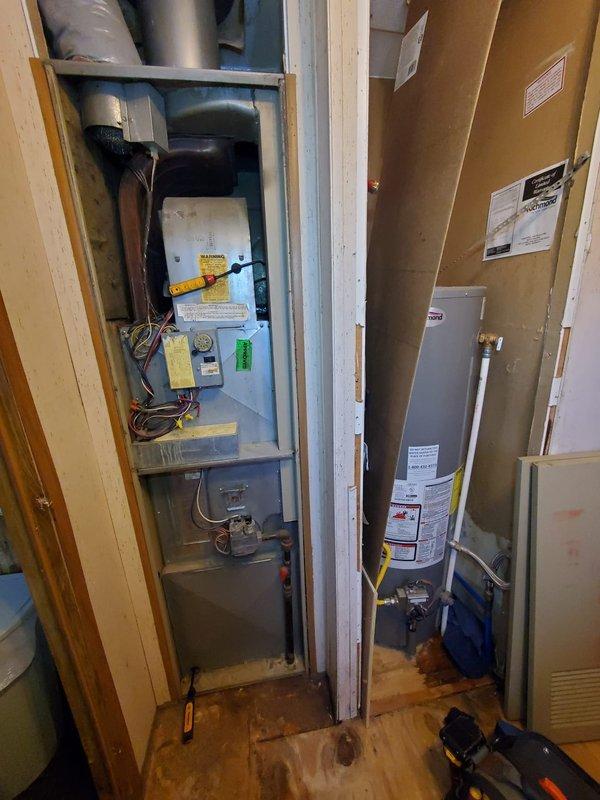 Diagnosed and serviced 30-year-old furnace in manufactured home that had completely failed, leaving customer dependent on stove and electric heaters for warmth. Upon inspection of the mechanical room, found multiple system failures in the aging unit requiring component replacement. Successfully restored heating function and verified proper operation through thermostat testing, bringing system back to operational status.