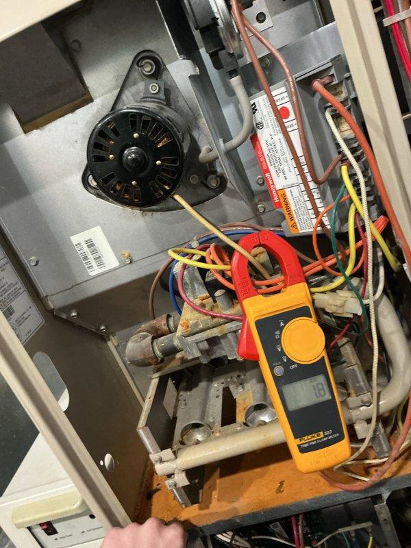 Diagnosed intermittent furnace ignition failure caused by insufficient voltage to ignition system, confirmed by multimeter readings showing 181V (below required threshold). Inspection revealed oxidation on burner assembly and signs of wear on gas valve components. Cleaned corroded connections and adjusted voltage to restore proper ignition sequence, resulting in consistent heating function.