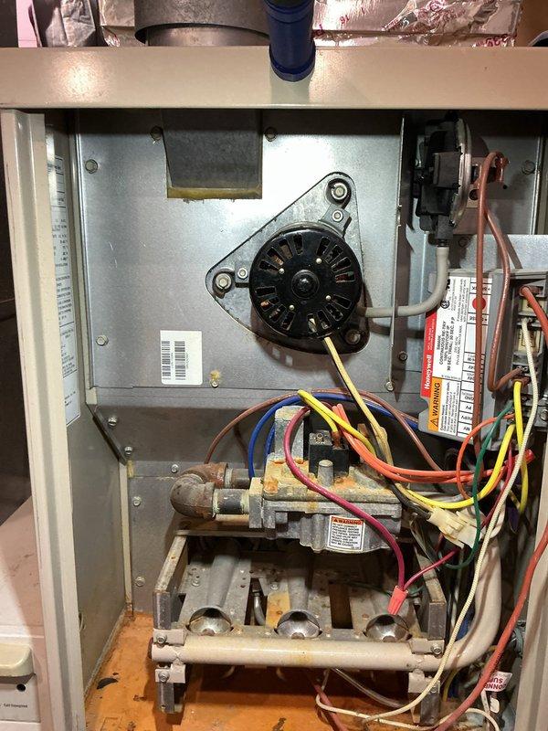 Diagnosed intermittent furnace ignition failure caused by insufficient voltage to ignition system, confirmed by multimeter readings showing 181V (below required threshold). Inspection revealed oxidation on burner assembly and signs of wear on gas valve components. Cleaned corroded connections and adjusted voltage to restore proper ignition sequence, resulting in consistent heating function.