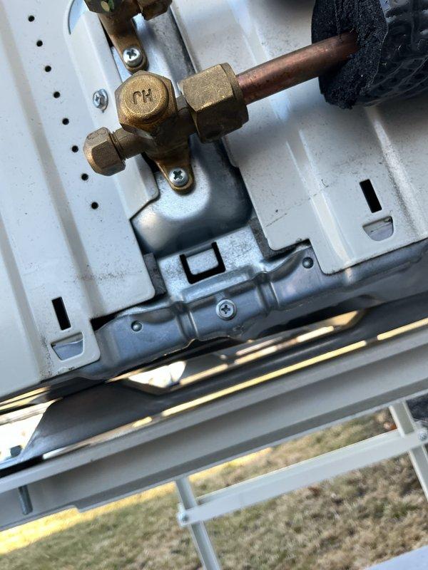 Performed diagnostic assessment on mini split system reported to be cycling inconsistently. Inspected refrigerant line connections and service valves (identified with "CH" marking) at the outdoor unit. Verified proper installation of copper lines and insulation integrity. System functionality was confirmed with normal operation parameters.