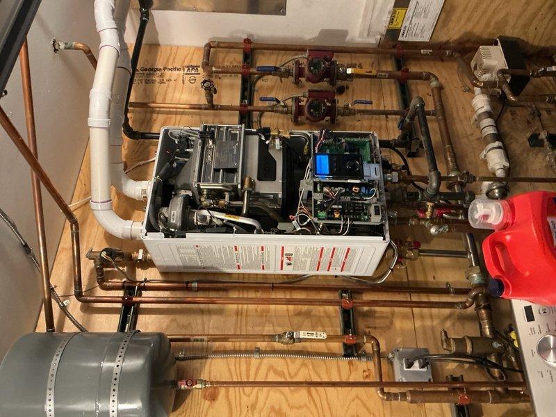 Completed Gold Boiler Inspection on a 22-year-old hot water boiler system located in customer's basement. Performed thorough examination of internal components including circuit boards, wiring, and mechanical elements. Inspected Neuma-Safe CN2-220 expansion tank, copper piping network, and valve functionality; system was found to be operational with no immediate concerns noted.