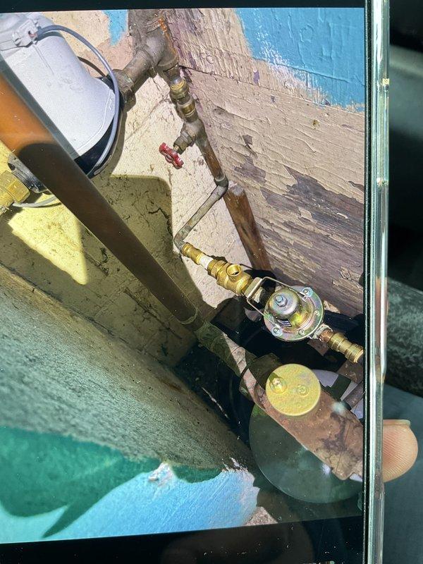 Performed boiler inspection and certification. System is functioning properly in a confined installation location with copper/brass plumbing components showing normal aging. Noted that future service may require technician able to work in tight spaces.