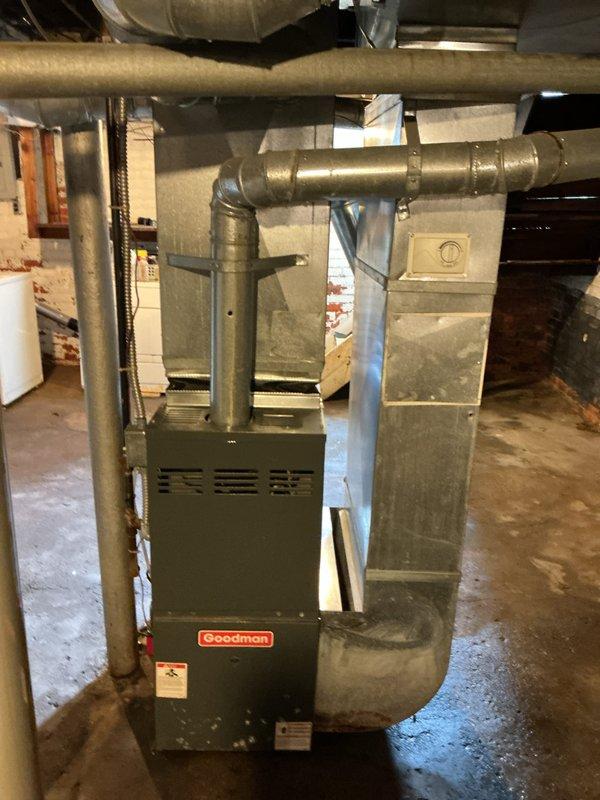 Conducted an estimate for furnace replacement at property due to water damage causing system failure. Existing Goodman furnace (15+ years old) was thoroughly inspected along with connected ductwork and ventilation components. Assessment showed significant water damage necessitating complete replacement of the basement-installed heating system.