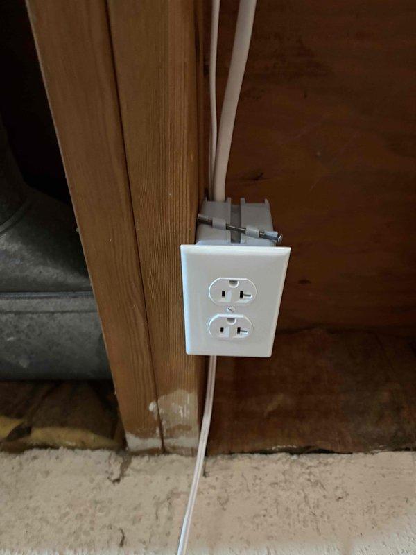 Completed installation of a surface-mounted duplex receptacle on wooden trim, along with a comprehensive electrical panel upgrade. Successfully installed and wired the main breaker panel with proper circuit distribution, including secondary sub-panel integration and conduit routing to connected outlets.