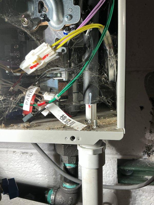 Successfully completed tankless water heater flush maintenance for homeowner. Identified PVC pipe leaking near condensation line which requires warranty service. System inspection revealed proper mounting and connection of supply lines, but interior components showed dust accumulation requiring cleaning.