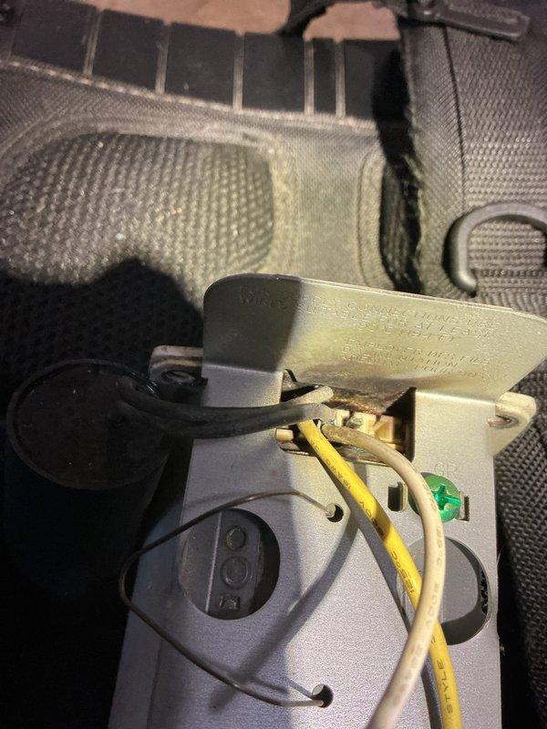 Diagnosed baseboard heating boiler failure resulting from recent storm damage. Removed and inspected electrical components, specifically focusing on the control assembly with wiring connections. Replaced damaged mounting bracket and reconnected all electrical terminals to restore proper boiler operation.