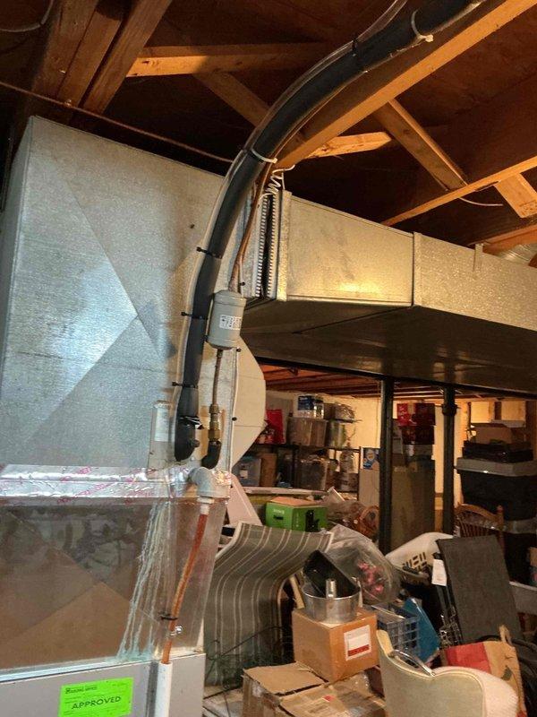 Responded to no-heat service call for an 11-year-old furnace in basement that would not turn on. Upon inspection of the aging unit with visible EnergyGuide label and "APPROVED" sticker, diagnosed and replaced faulty control module. System now operating properly with all connections verified and tested for proper heating function.