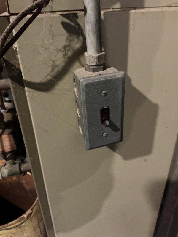 Responded to service call for leaking boiler of undetermined age (likely original to building) located in basement. Inspected system including pipe connections, valve assembly, and electrical components. Despite leak, unit continues to provide adequate heat; documented condition with photographs for future reference.