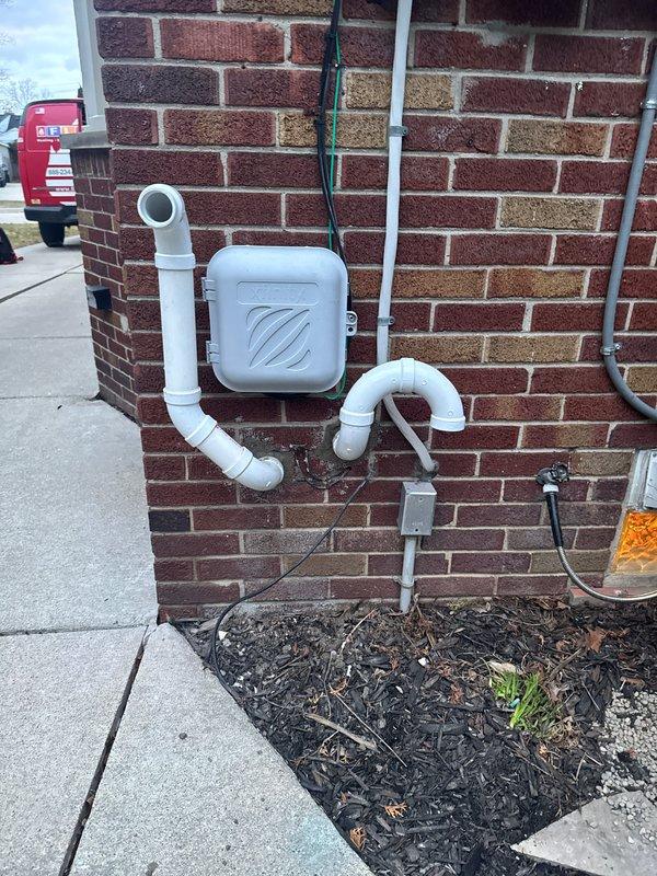 Completed installation of a complete HVAC system including a 70,000 BTU furnace (repositioned 3 inches left), 2.5-ton AC unit, 600m air handler, S40 thermostat, and humidifier. All components were properly connected and tested with appropriate measurements verified using UEi EM201B meter, with the outdoor unit properly mounted on exterior wall with PVC connections installed to manufacturer specifications.